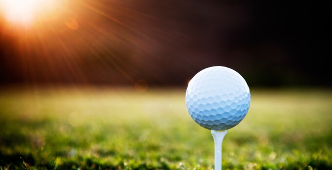 Golf Ball on Tee with Sunrise Antelope Hills Golf Coures golf ball on tee