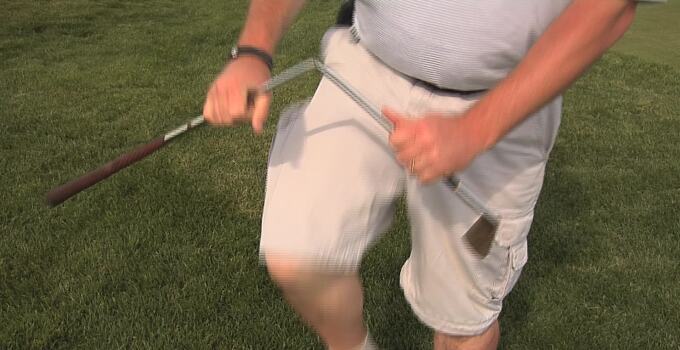 Break golf club over knee Break golf club over knee